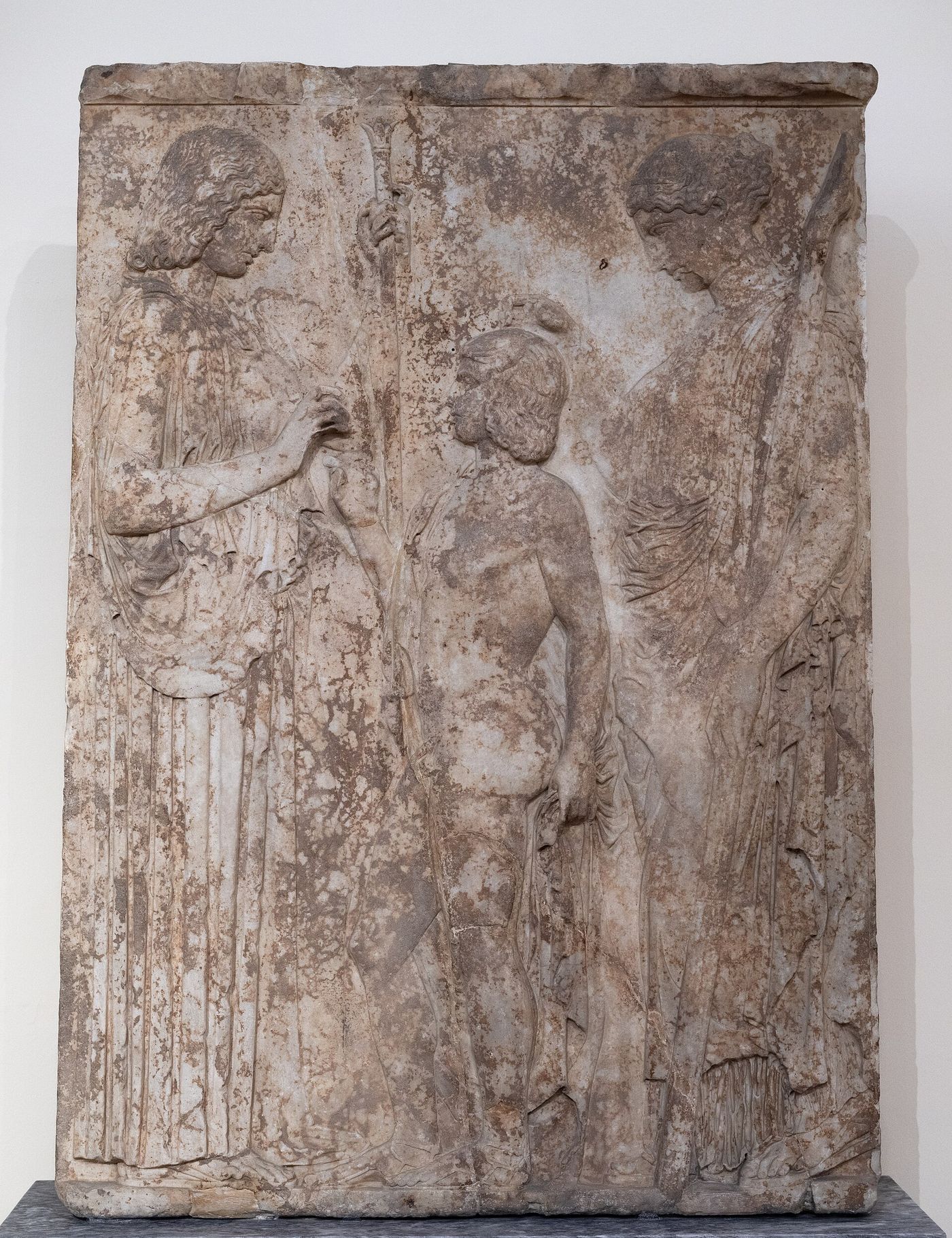 Marble relief showing Demeter handing grain to the boy Triptolemos, with Persephone standing behind him holding a torch.